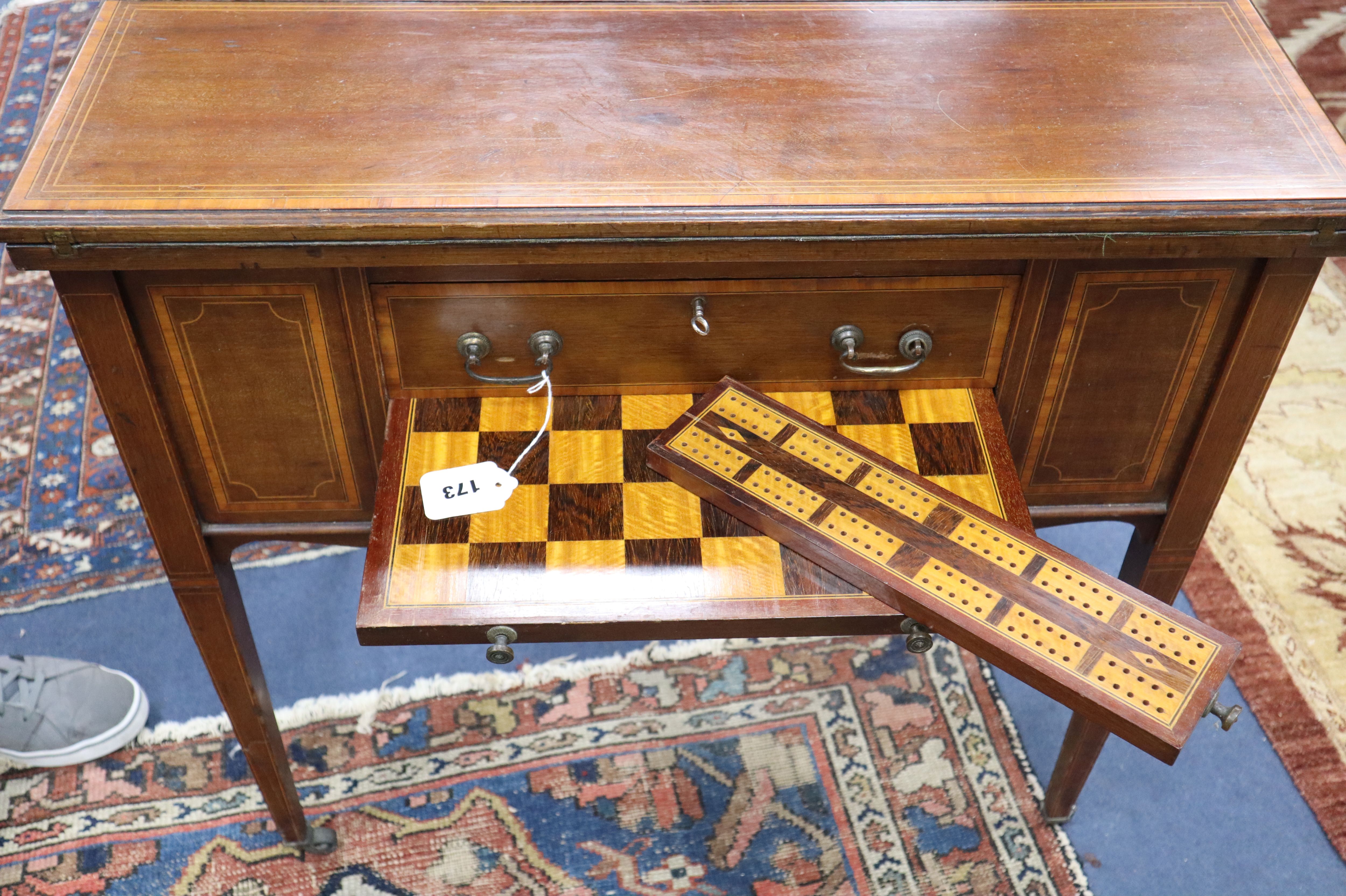 An Edwardian satinwood banded mahogany games/drinks table,
